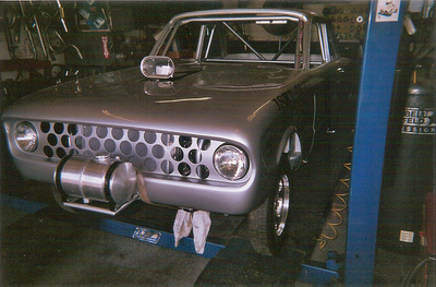 Custom Mufflers — Front Bumper of Grey Vintage Car in Bakersfield, CA