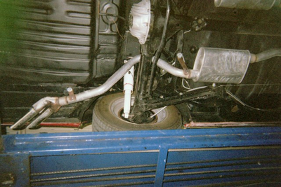 Muffler Service — Undercarriage Axis and Wheel Close-up in Bakersfield, CA