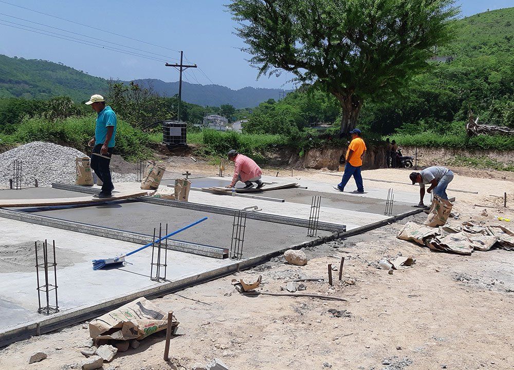 People Layering Cement