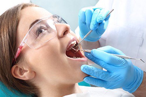 Dentist Checking Patient's Teeth