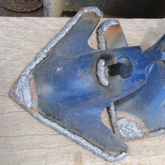 plow with tungsten hard facing reinforcement