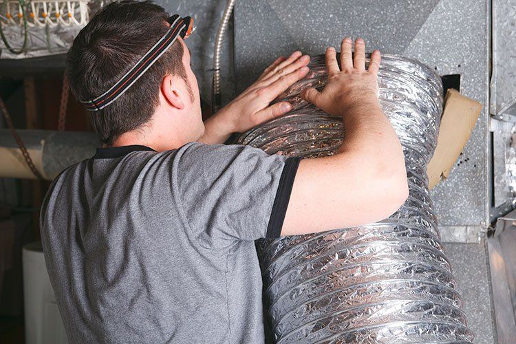 Man Cleaning The Air Duct — Gallatin, TN — Master’s Touch Cleaning and Restoration