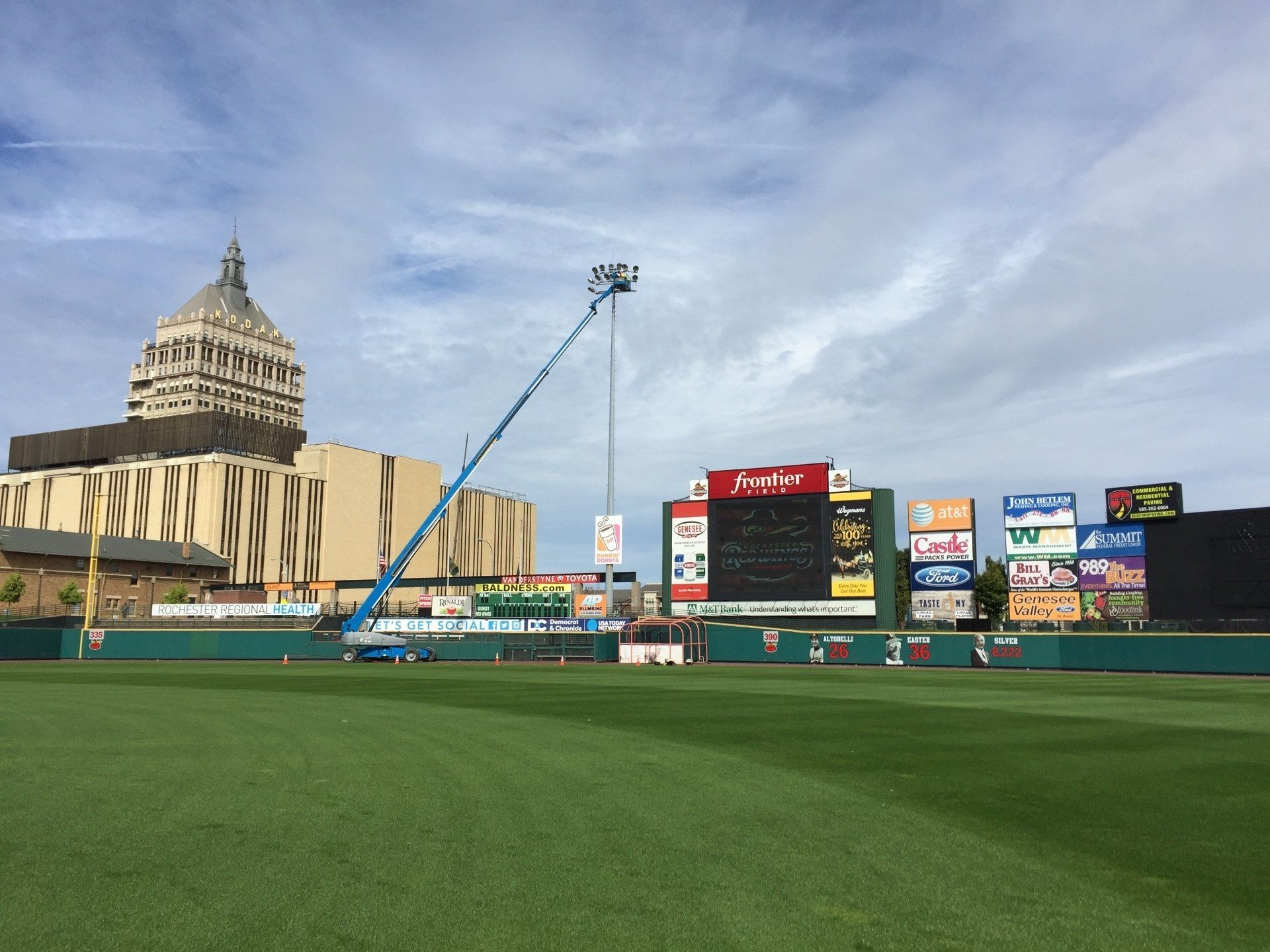 Bison's Baseball field with a blue lift in the outfield, a scoreboard.