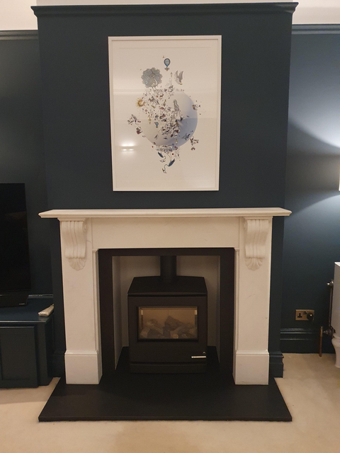 Black stove in a brick alcove