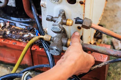 Technicians were repairing air-conditioning - Heating and Cooling Services in Annapolis, MD Technicians were repairing air-conditioning - Heating and Cooling Services in Annapolis, MD