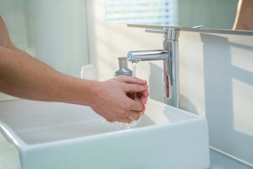 Water Treatment — Man Washing Hands in Clearwater, FL