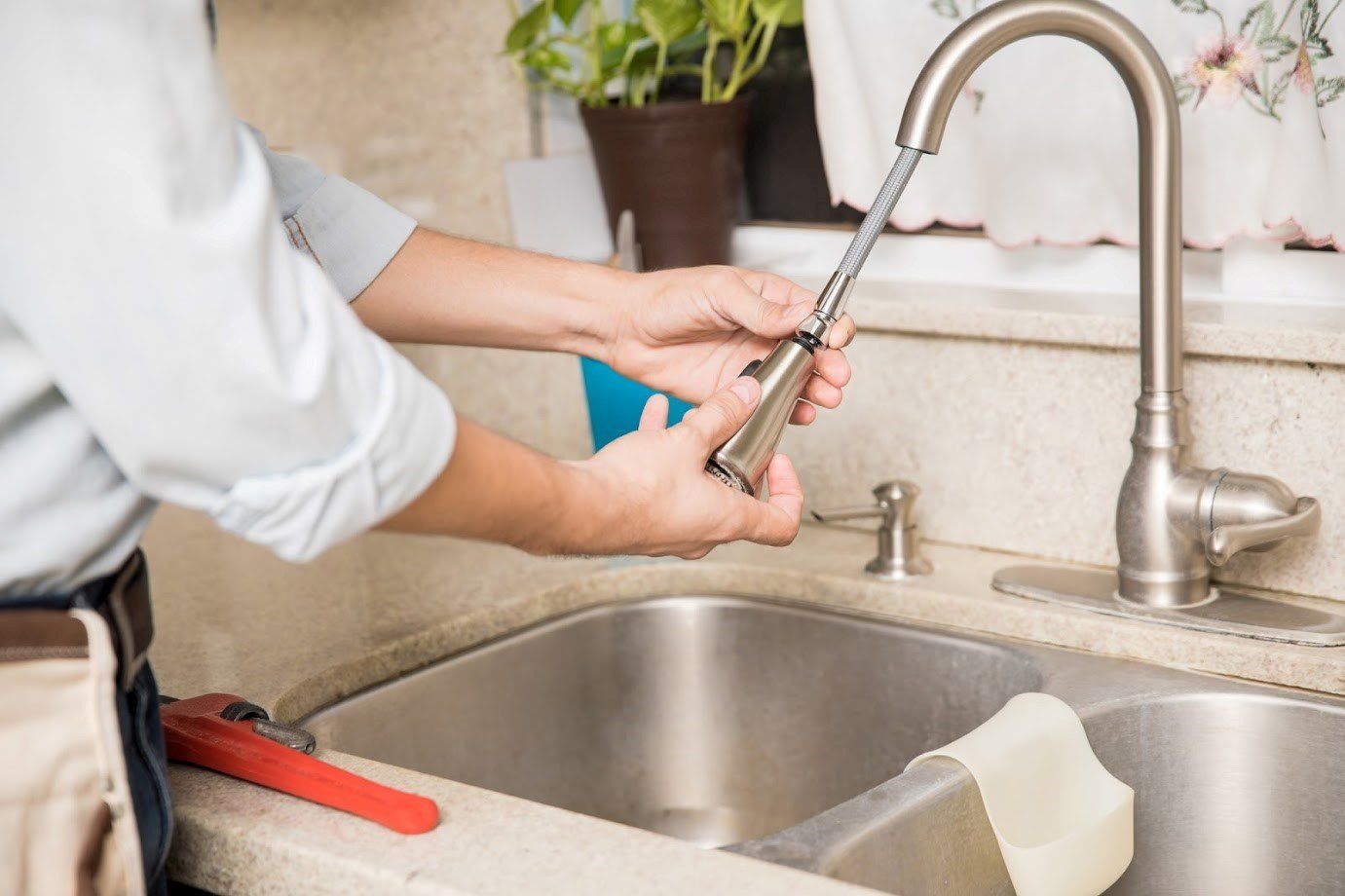 Plumber Fixing Faucet — Clearwater, FL — Scotto Services Plumbing Plumber Fixing Faucet — Clearwater, FL — Scotto Services Plumbing