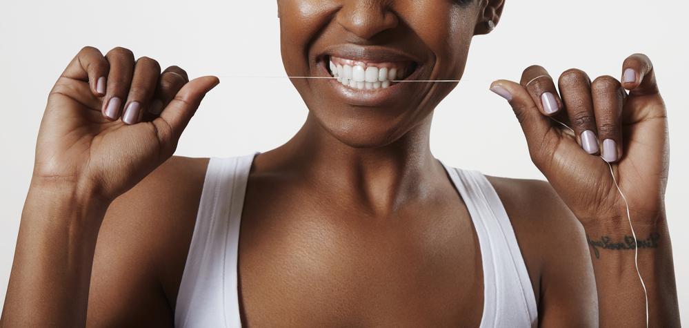 Woman Doing Teeth Floss — Clearwater, FL — Scotto's Plumbing