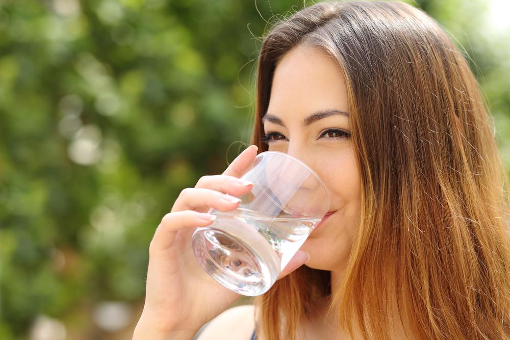 Plumbing Service — Woman Drinking Water in Clearwater, FL
