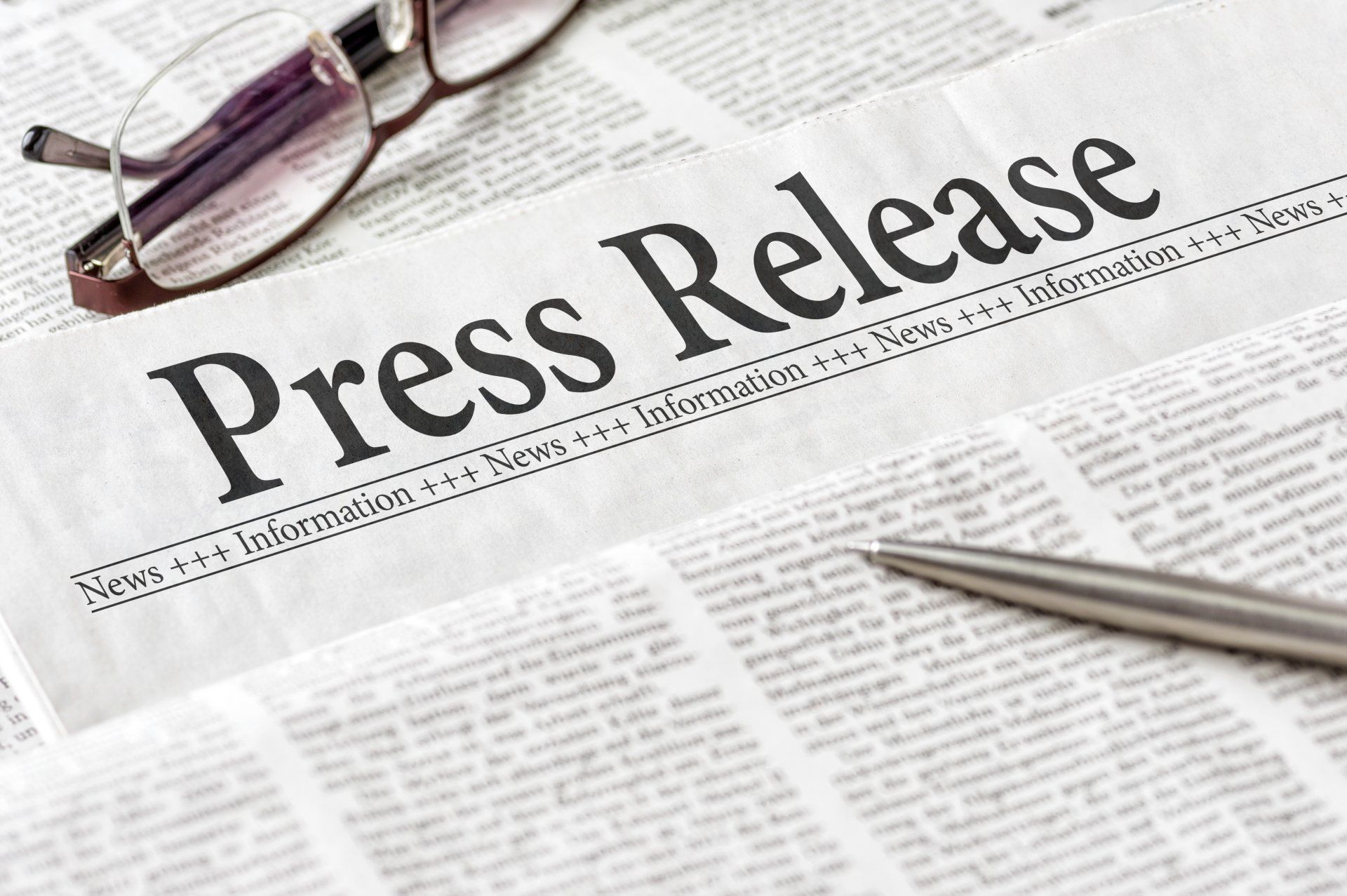 A newspaper with the word press release written on it.