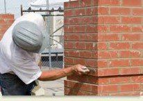 Man Leveling Wall | Chicago, IL | Turek & Sons