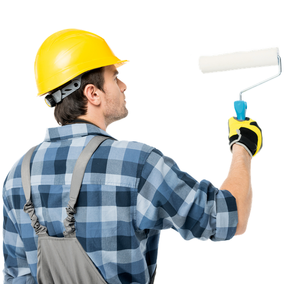Painter wearing a hard hat and gloves, using a paint roller on a white wall.