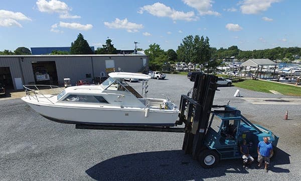 boat being moved on hydraulic lift