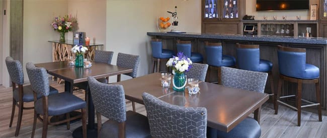 tables at bar in Anchored Inn