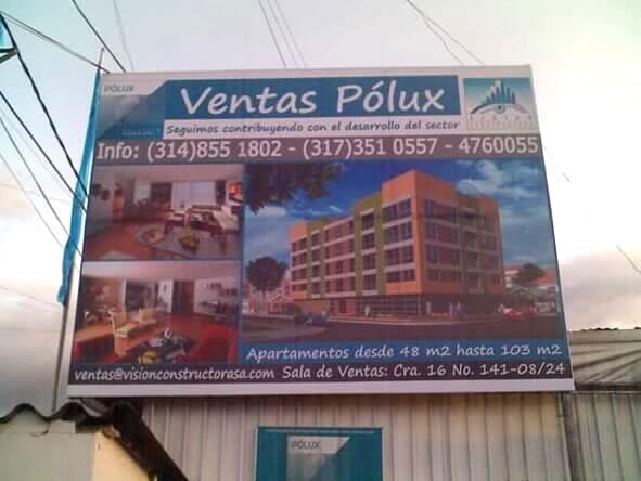 Cartel publicitario de los apartamentos Ventas Pólux, con fotos del edificio y números de teléfono de contacto.