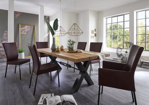 white dining chairs and tables with a beautiful flower vase