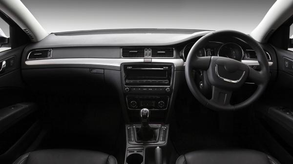 A black and white photo of the interior of a car