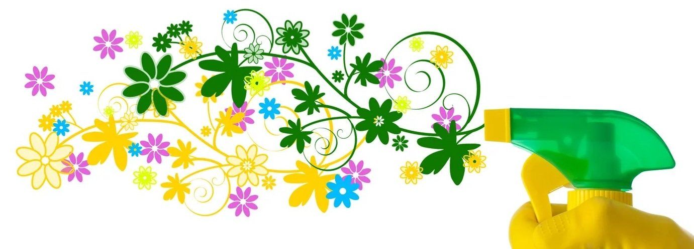 A green spray bottle with flowers on it