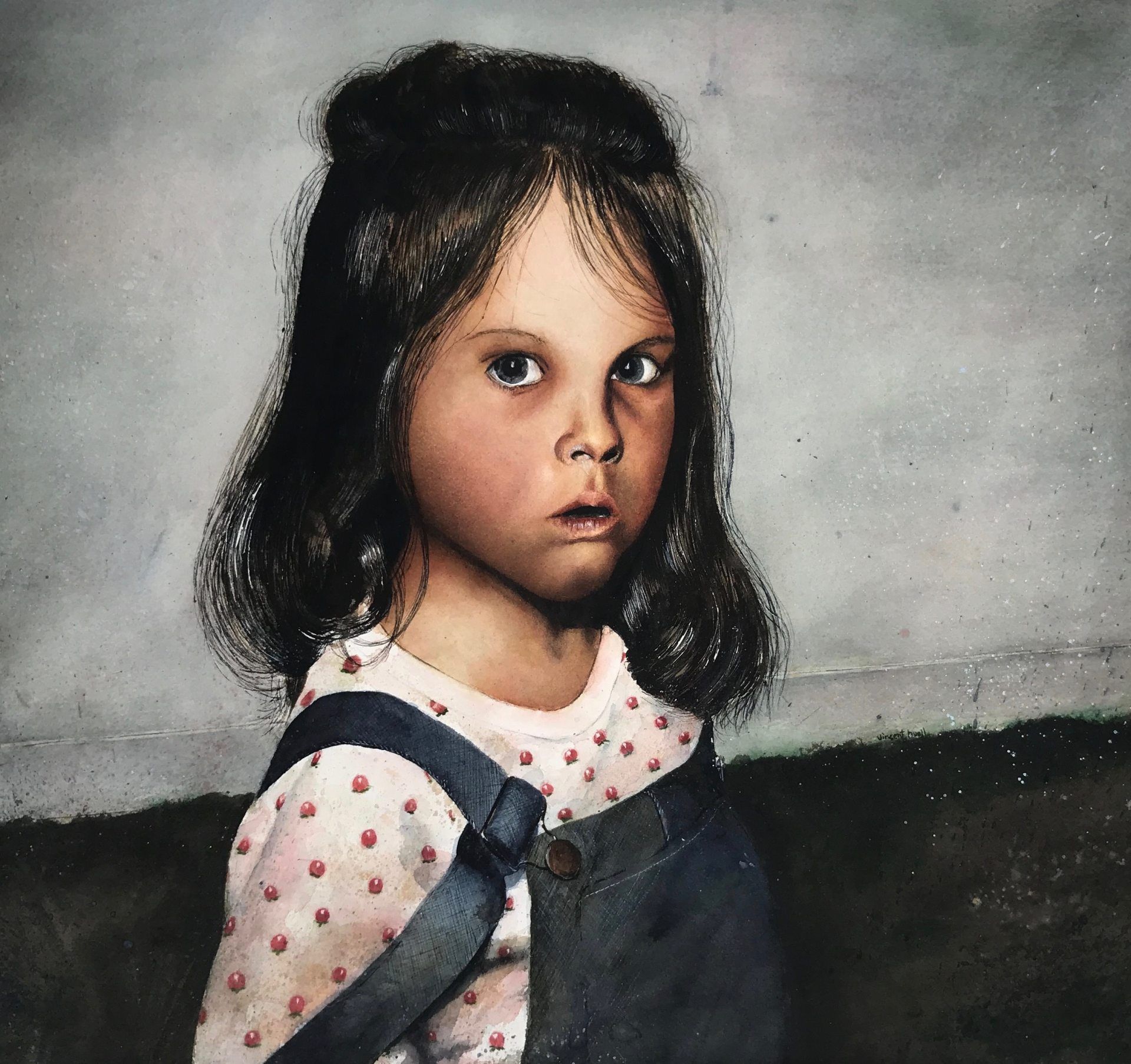 A little girl wearing overalls and a polka dot shirt
