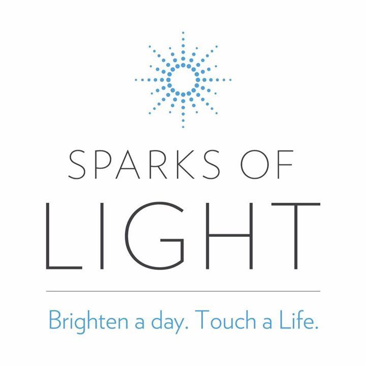 A logo for sparks of light that says `` brighten a day . touch a life . ''