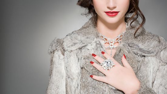 Woman Wearing Fur Coat and Jewelry — Bayonne, NJ — Famous Furs Ltd. Woman Wearing Fur Coat and Jewelry — Bayonne, NJ — Famous Furs Ltd.