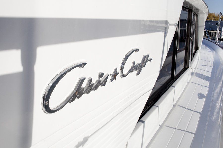 A white boat with the name chris & chris on the side