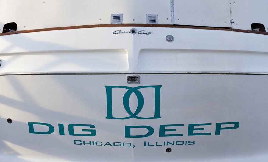 The back of a boat that says 