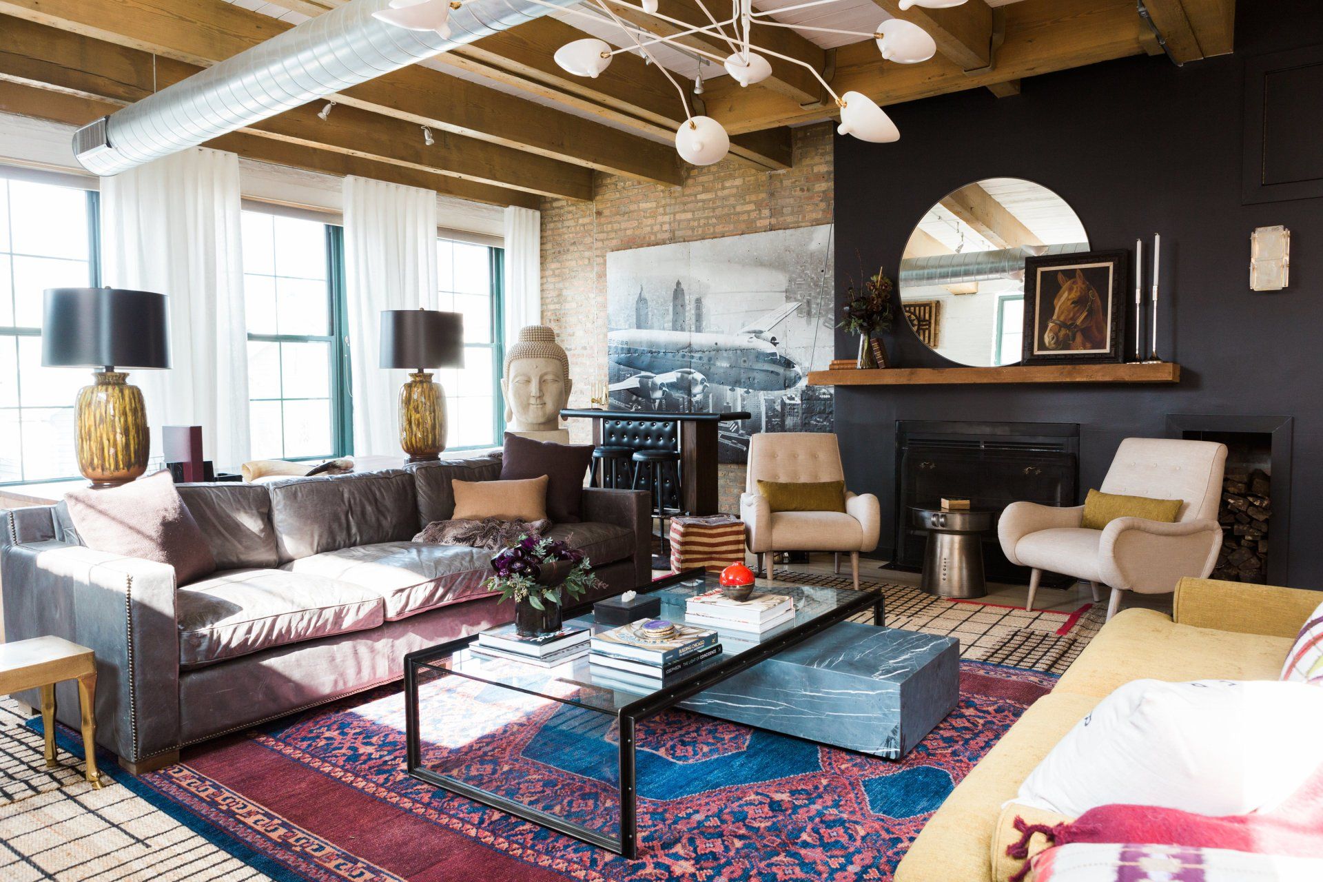 A living room filled with furniture and a fireplace.