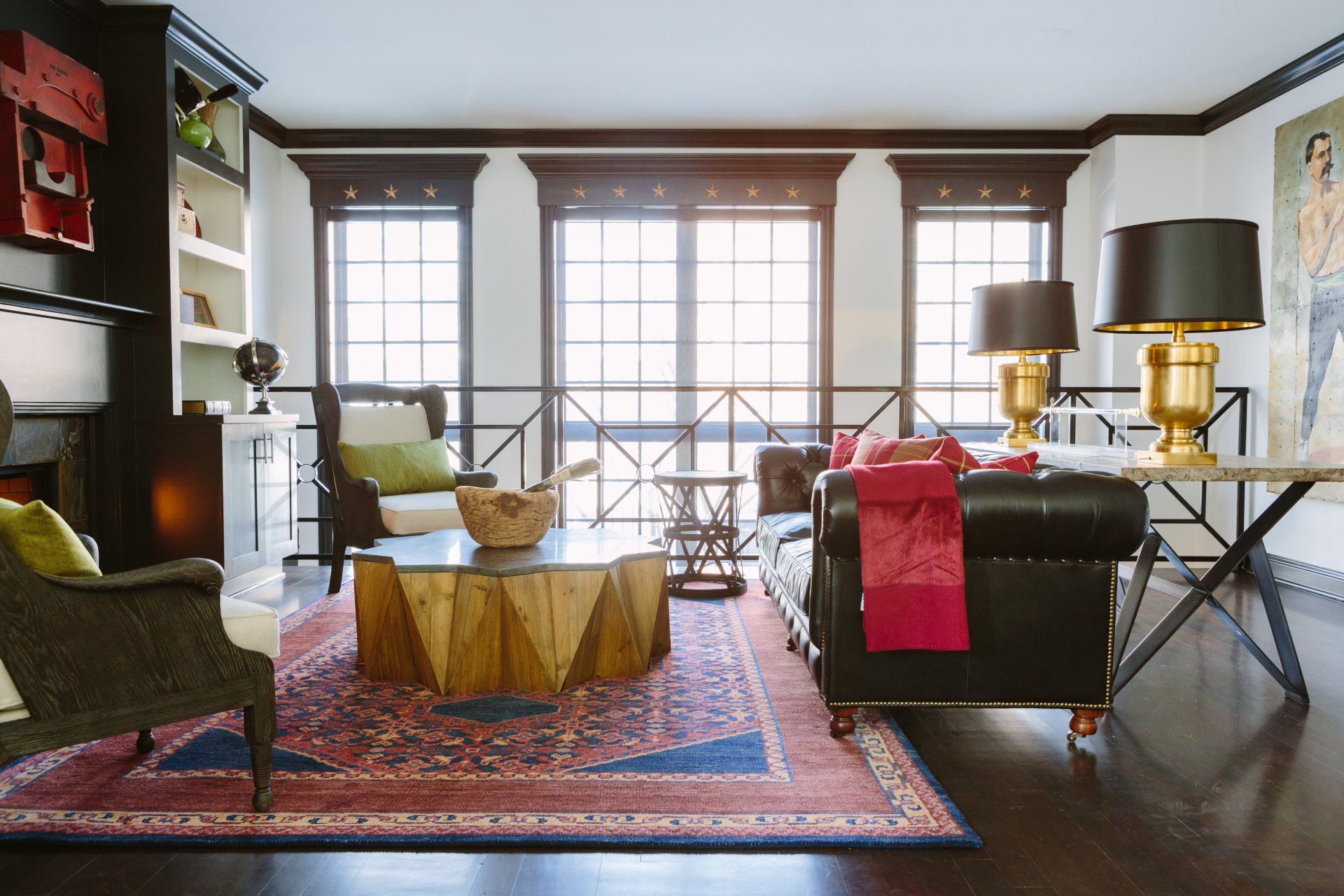 A living room filled with furniture and a rug.