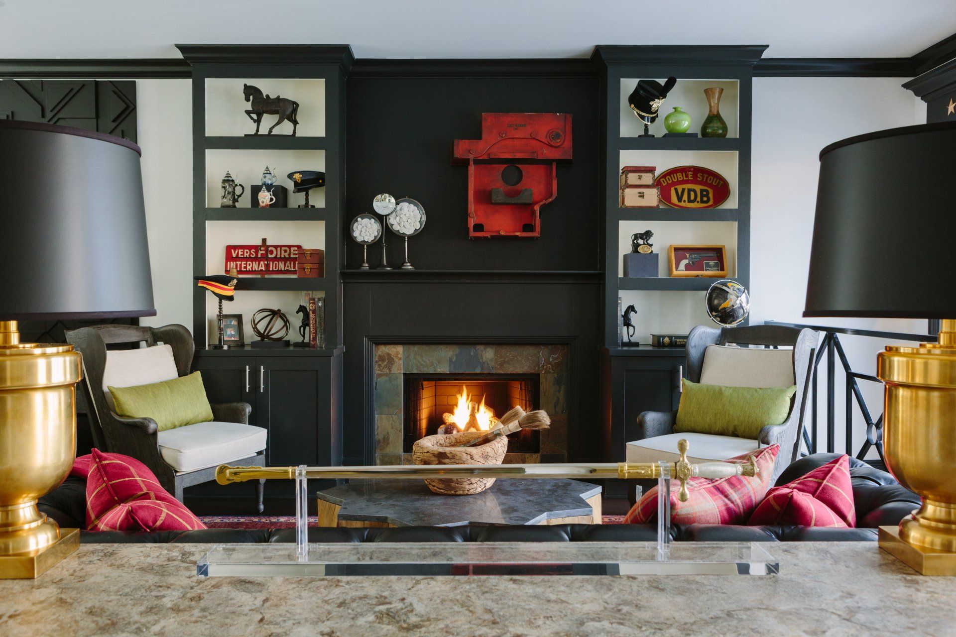 A living room with a fireplace and two lamps