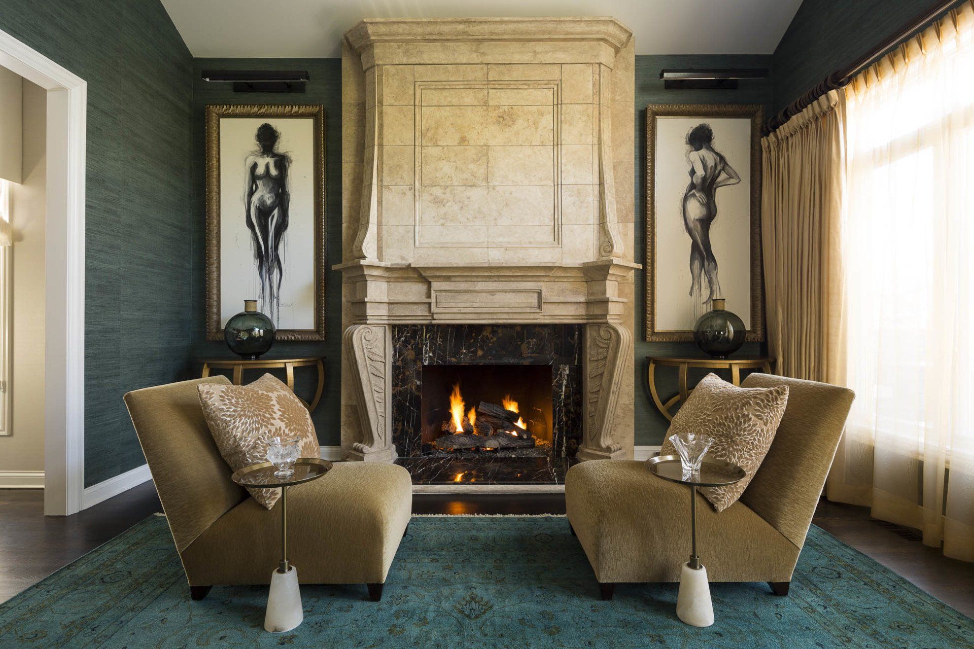 A living room with two chairs and a fireplace