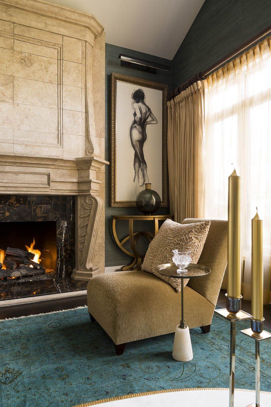 A living room with a fireplace and a chair
