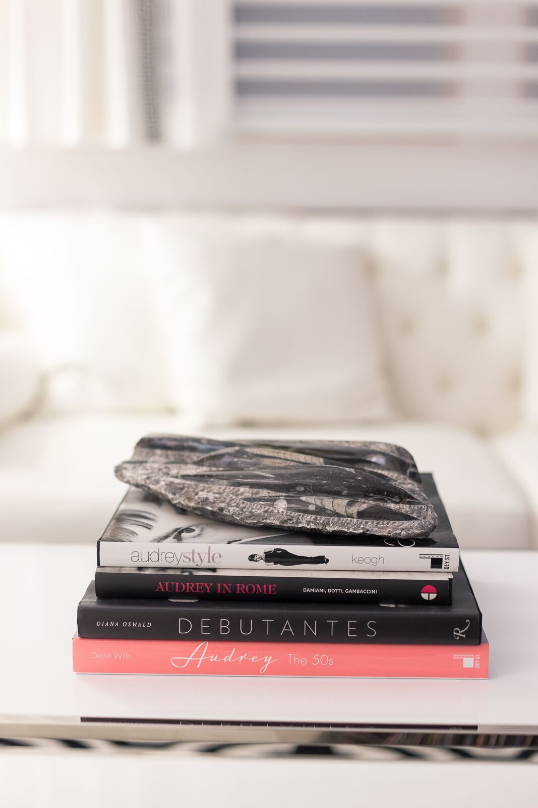 A stack of books sitting on top of each other on a table.