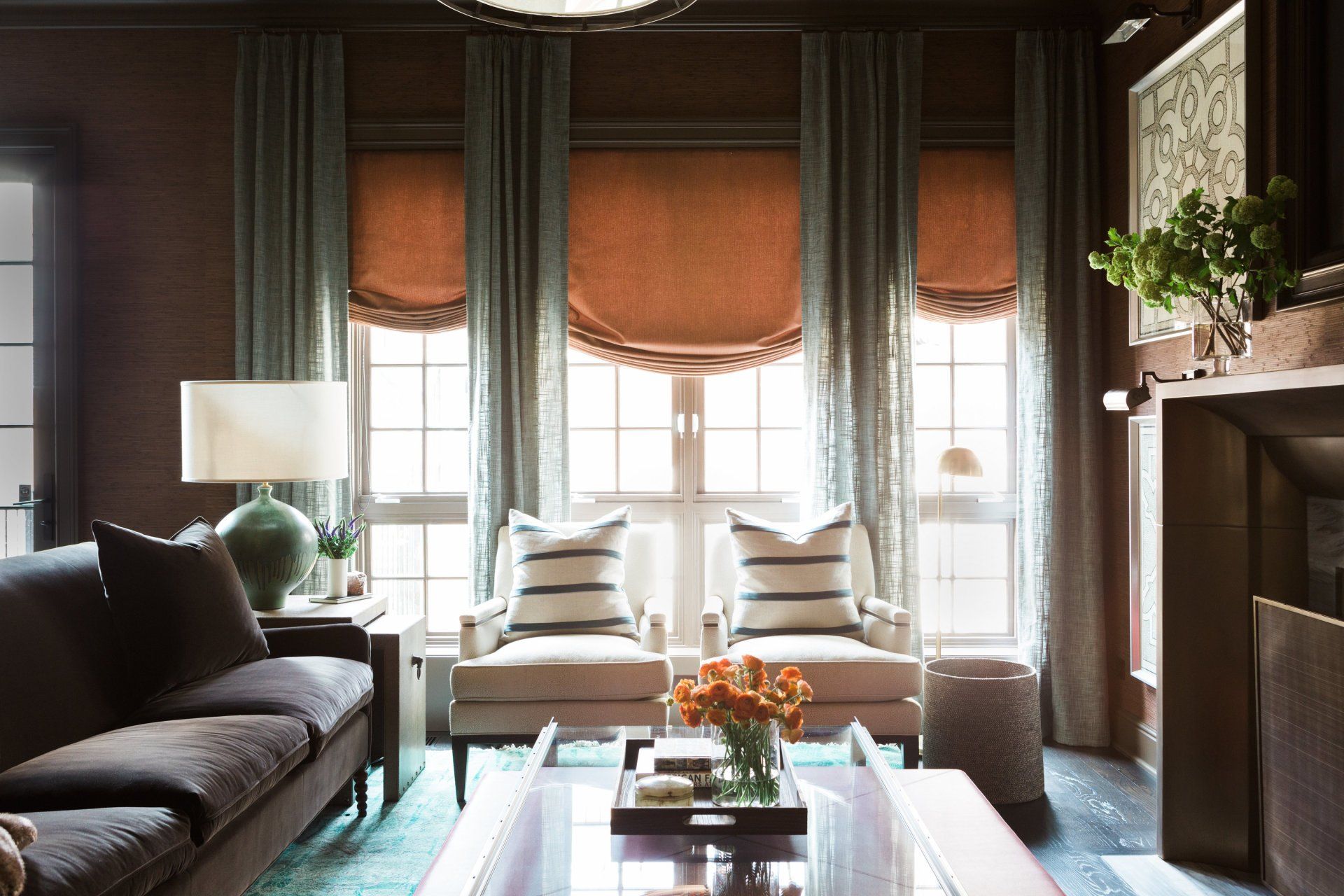 A living room with a couch , chairs and a coffee table