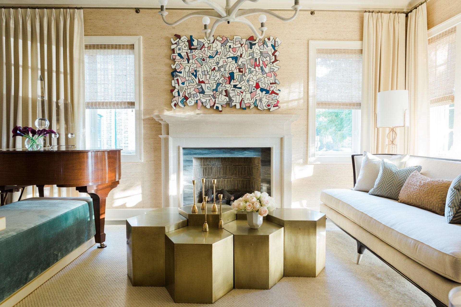 A living room with a piano and a fireplace