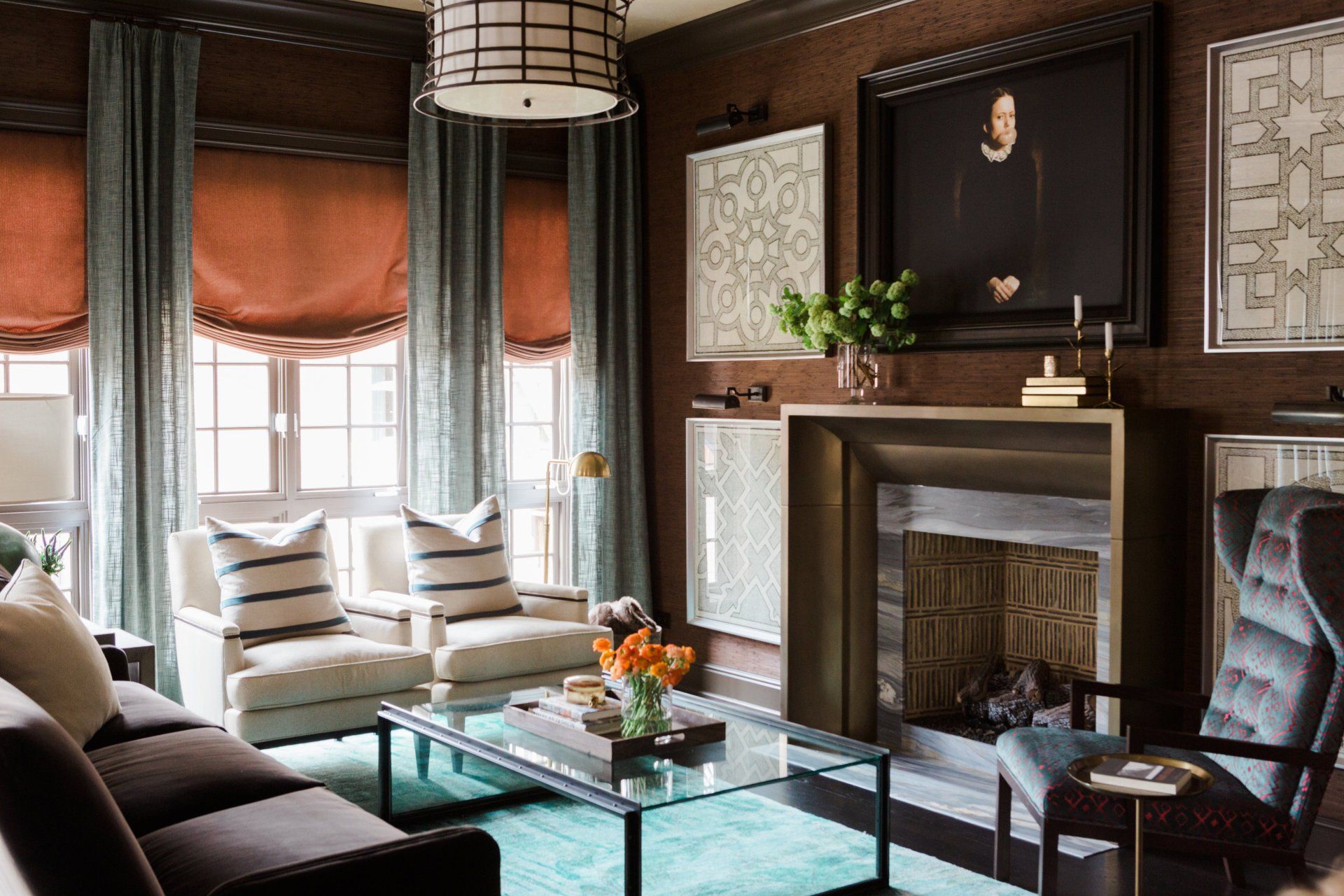 A living room with a couch , chairs , coffee table and fireplace.