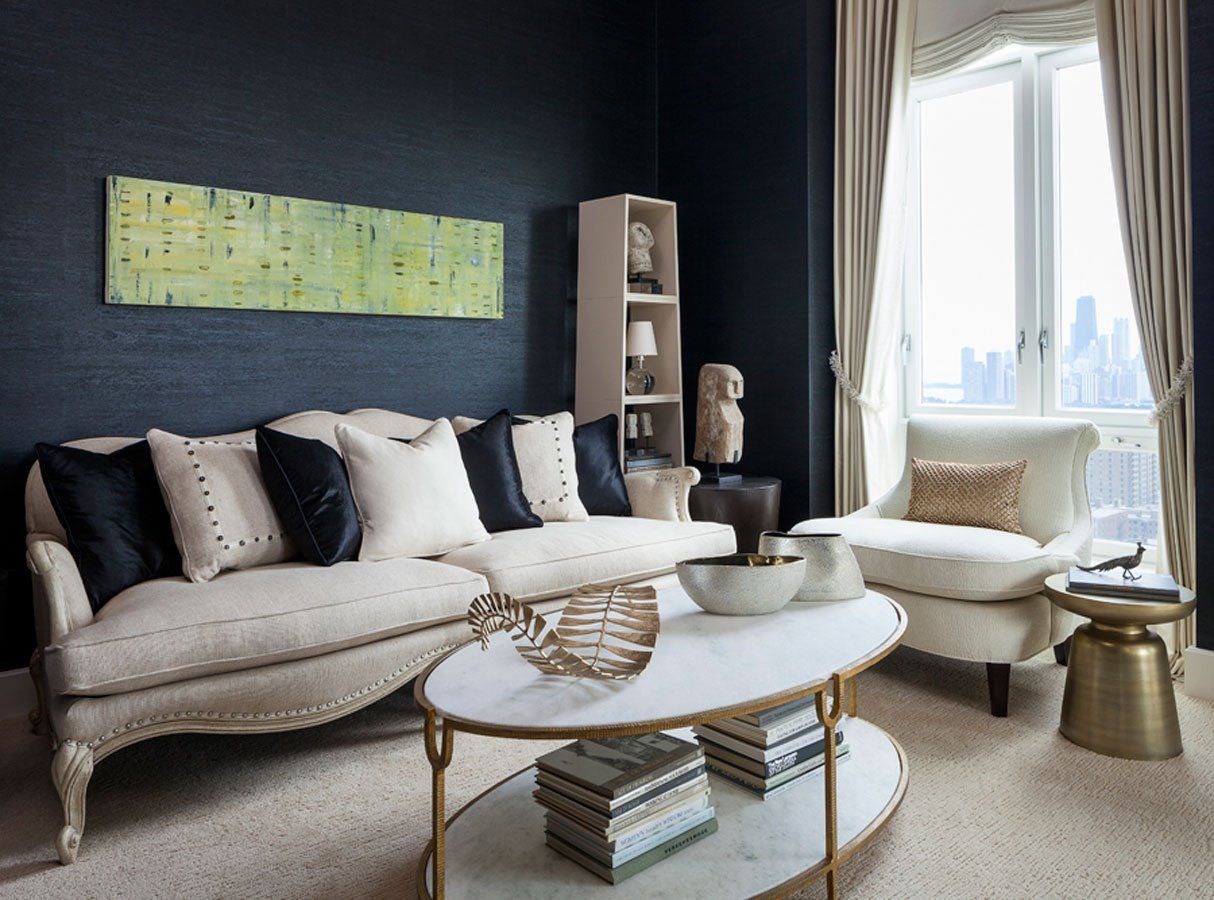 A living room with a couch , chair and coffee table