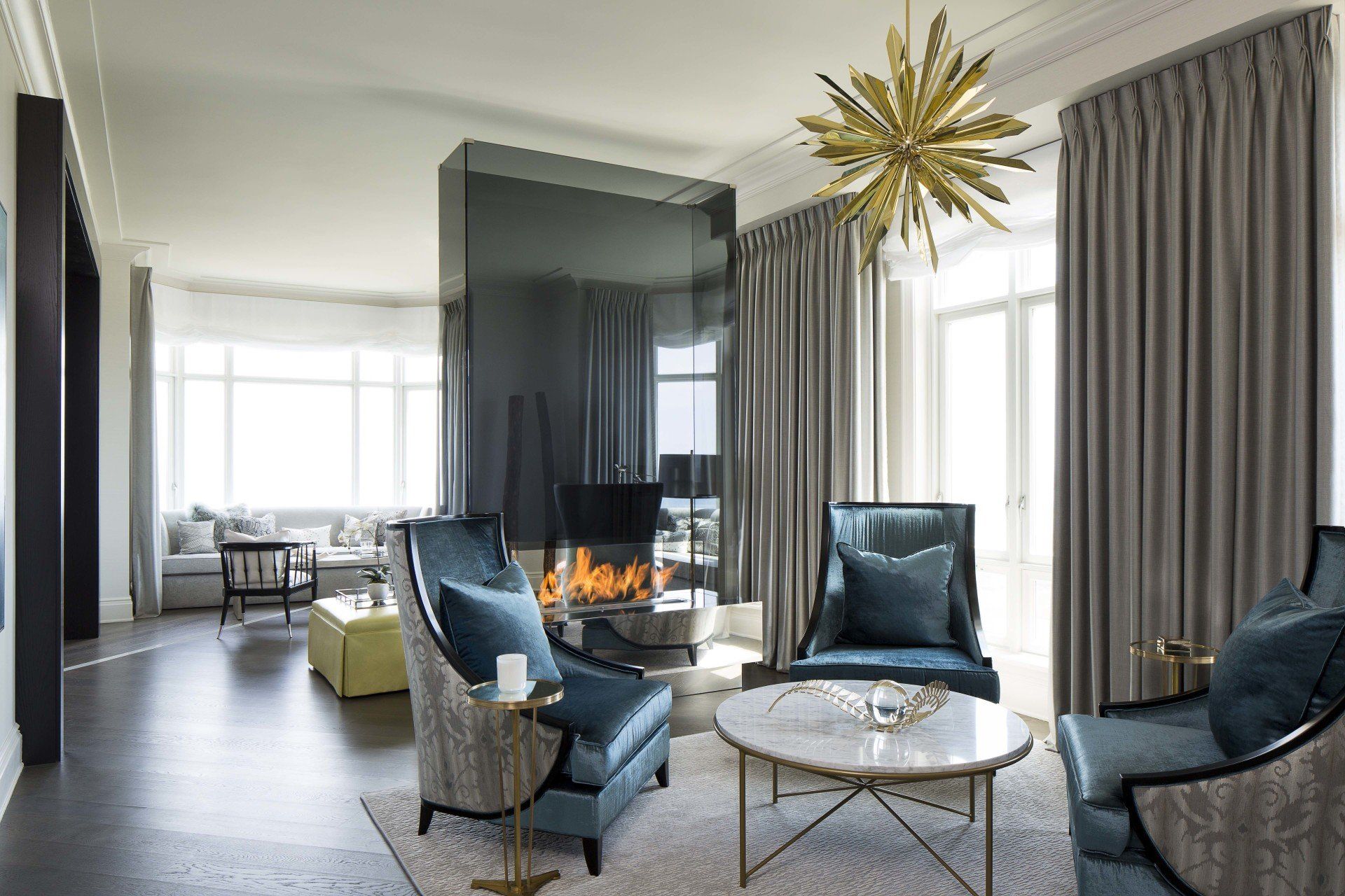 A living room filled with furniture and a fireplace.