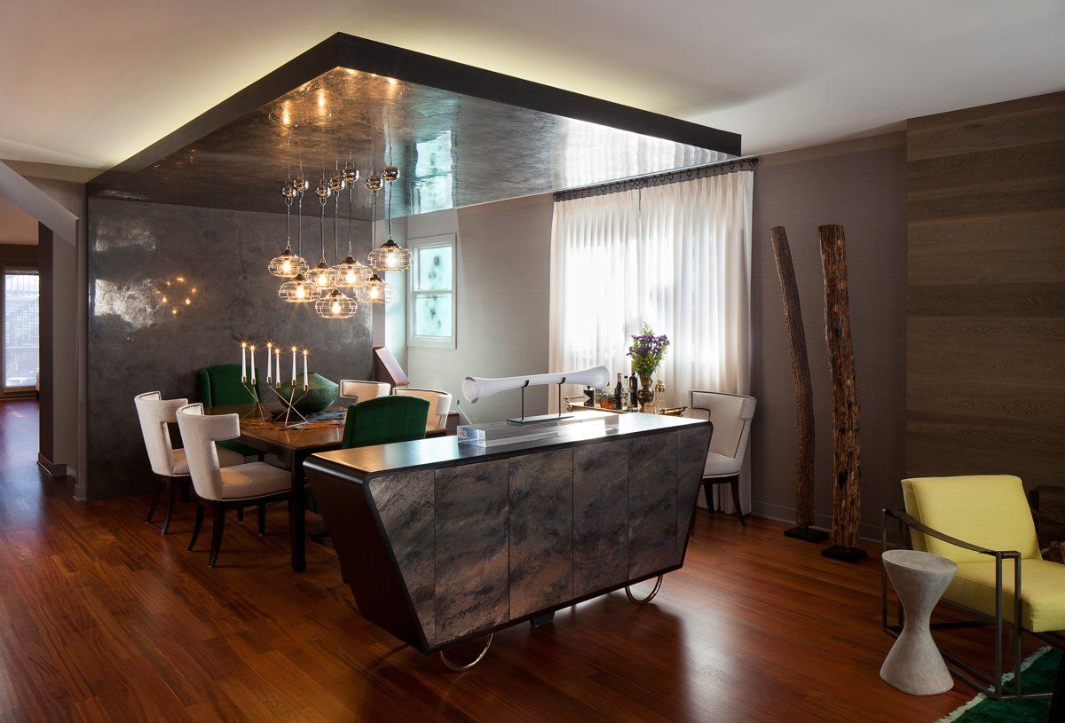 A living room with a dining room table and chairs