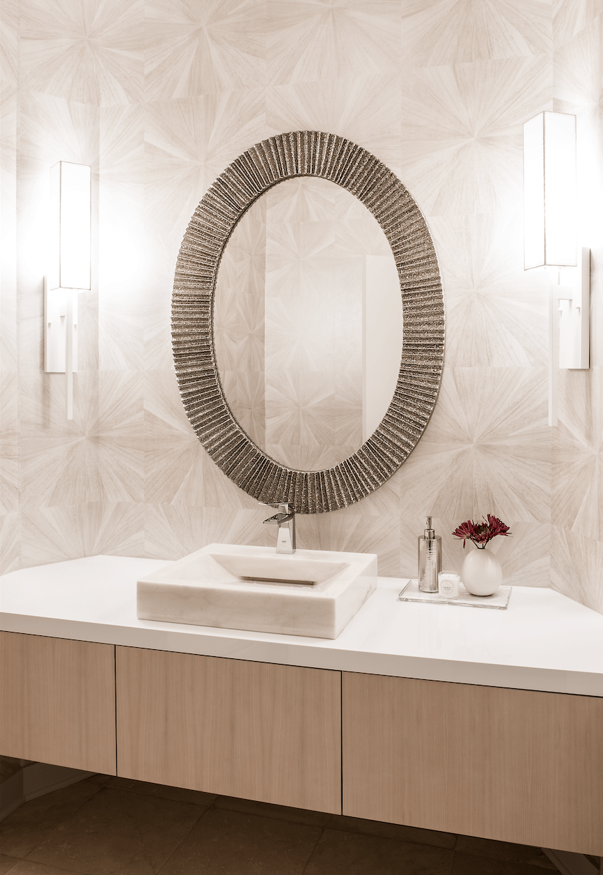 A bathroom with a sink and a mirror on the wall