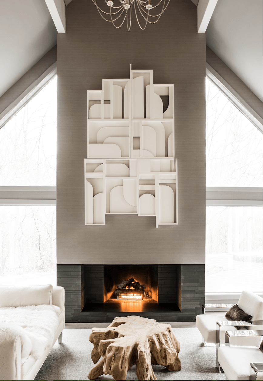 A living room with a fireplace and a wooden coffee table
