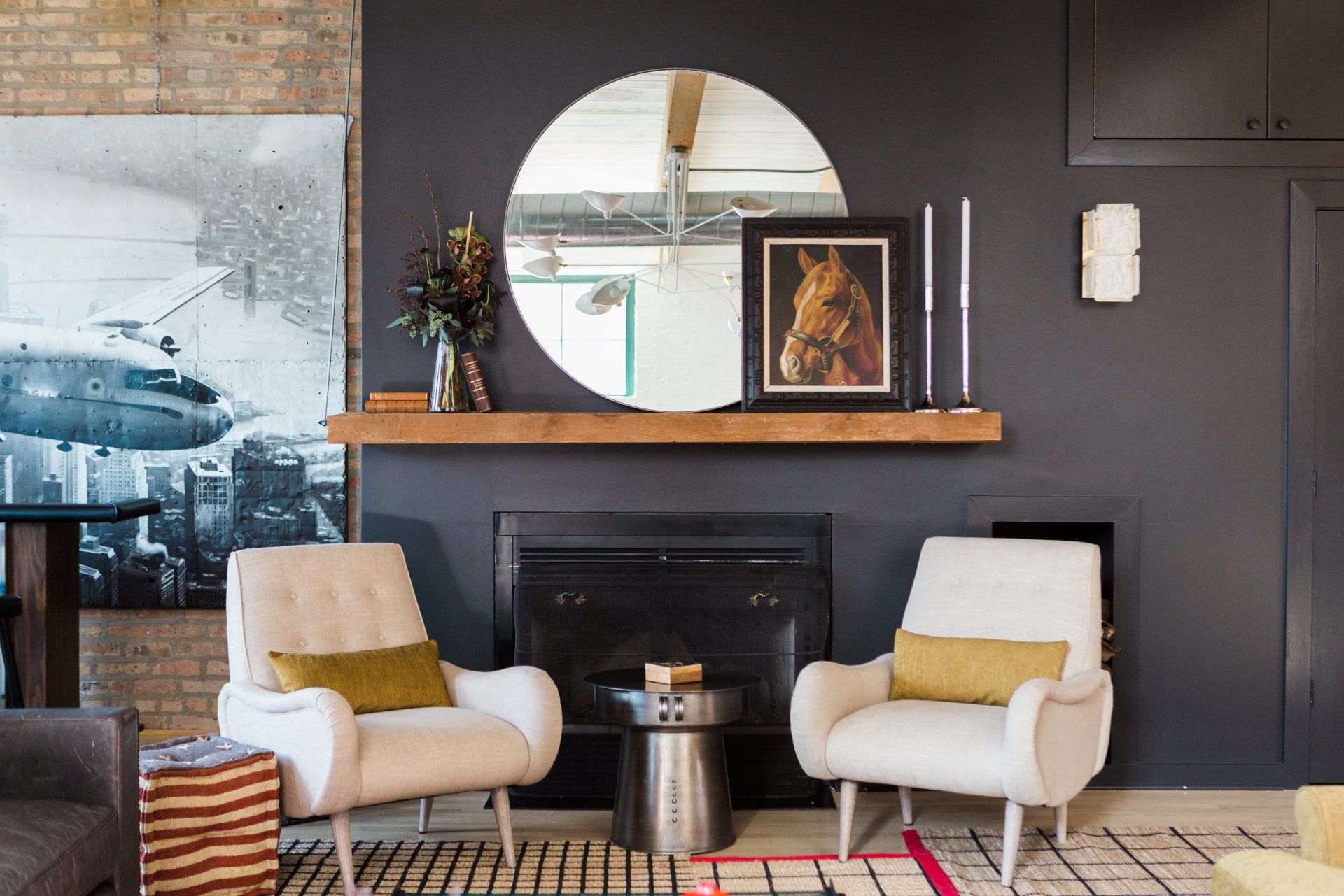 A living room with two chairs and a fireplace