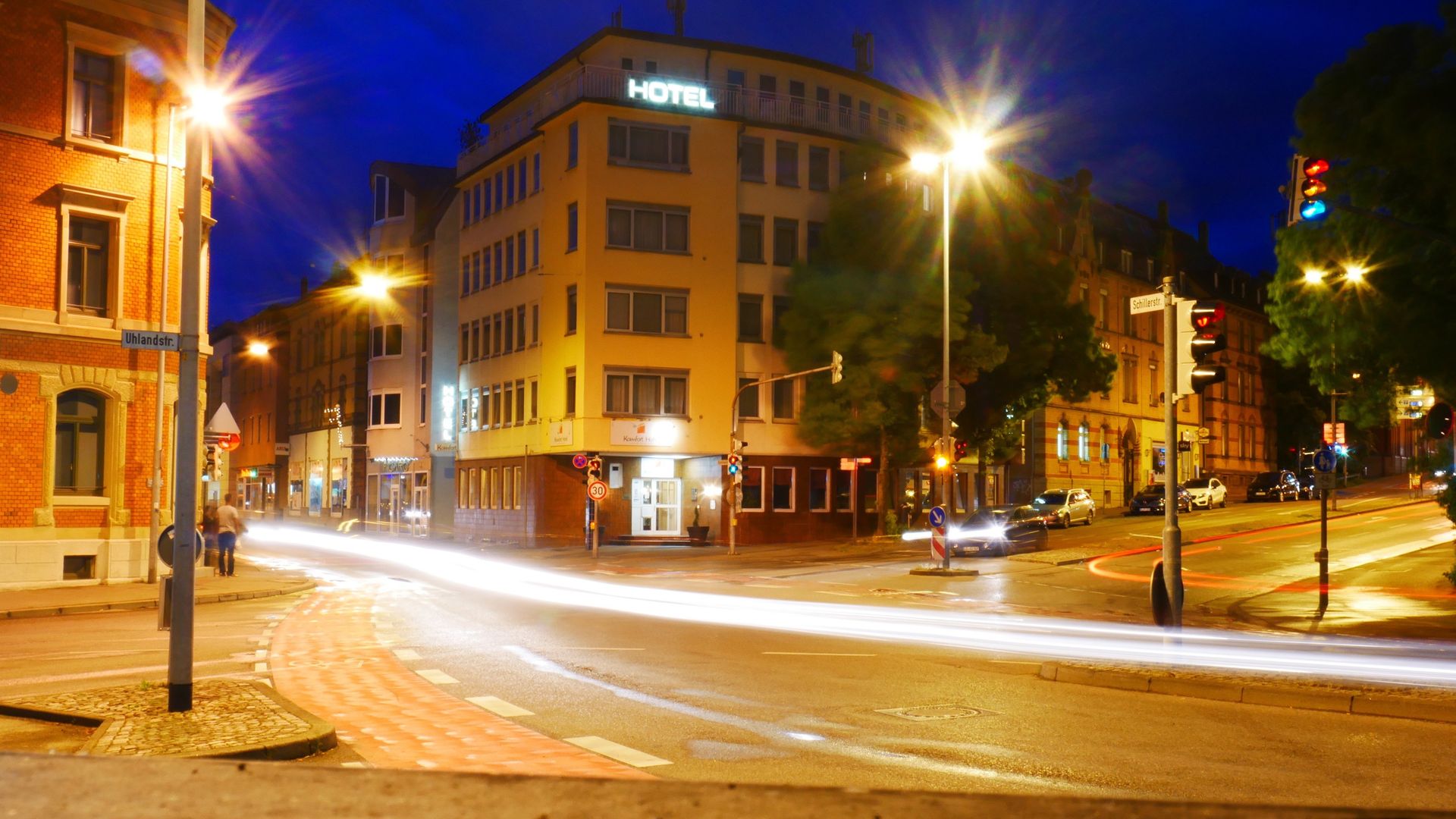 A long exposure photo of a city street at night