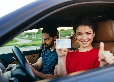 Woman Holding Drivers License — Auburn, WA — Auburn License Agency, Inc. Woman Holding Drivers License — Auburn, WA — Auburn License Agency, Inc.