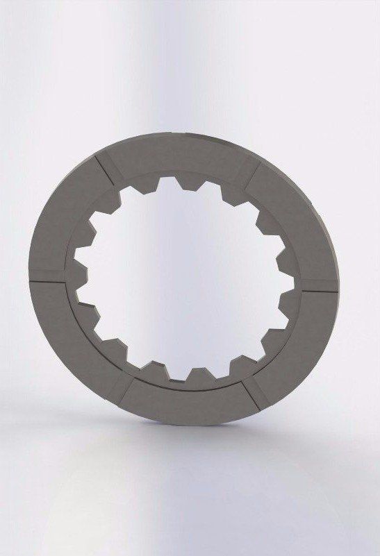Gray, circular part with inner gear teeth and separated into four segments.