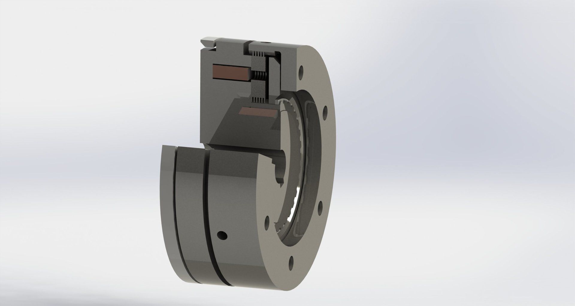 Cutaway view of a dark metal mechanical part with a circular flange and internal components.