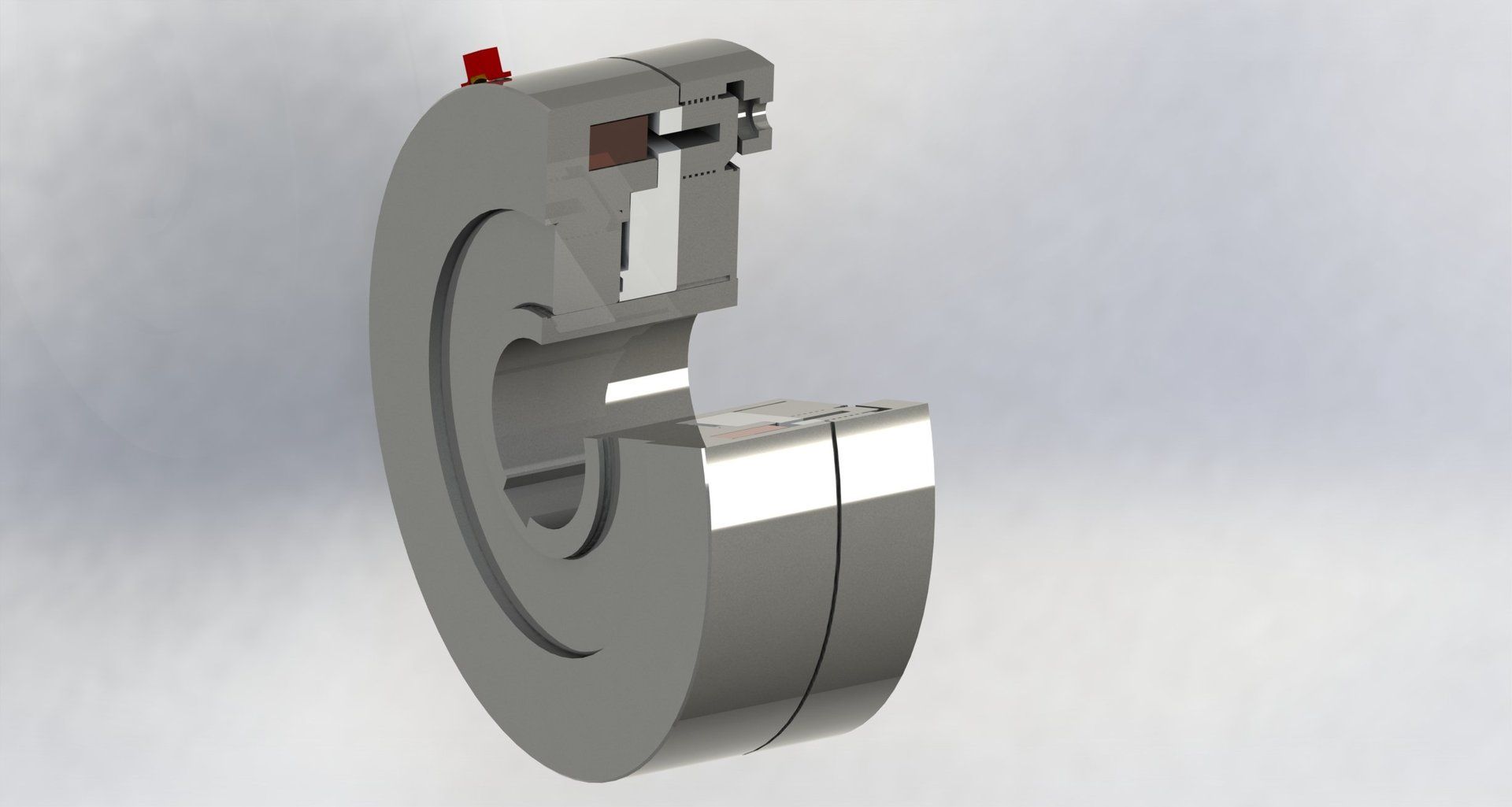 Cutaway view of a mechanical device showing internal components; mostly silver with a red indicator.