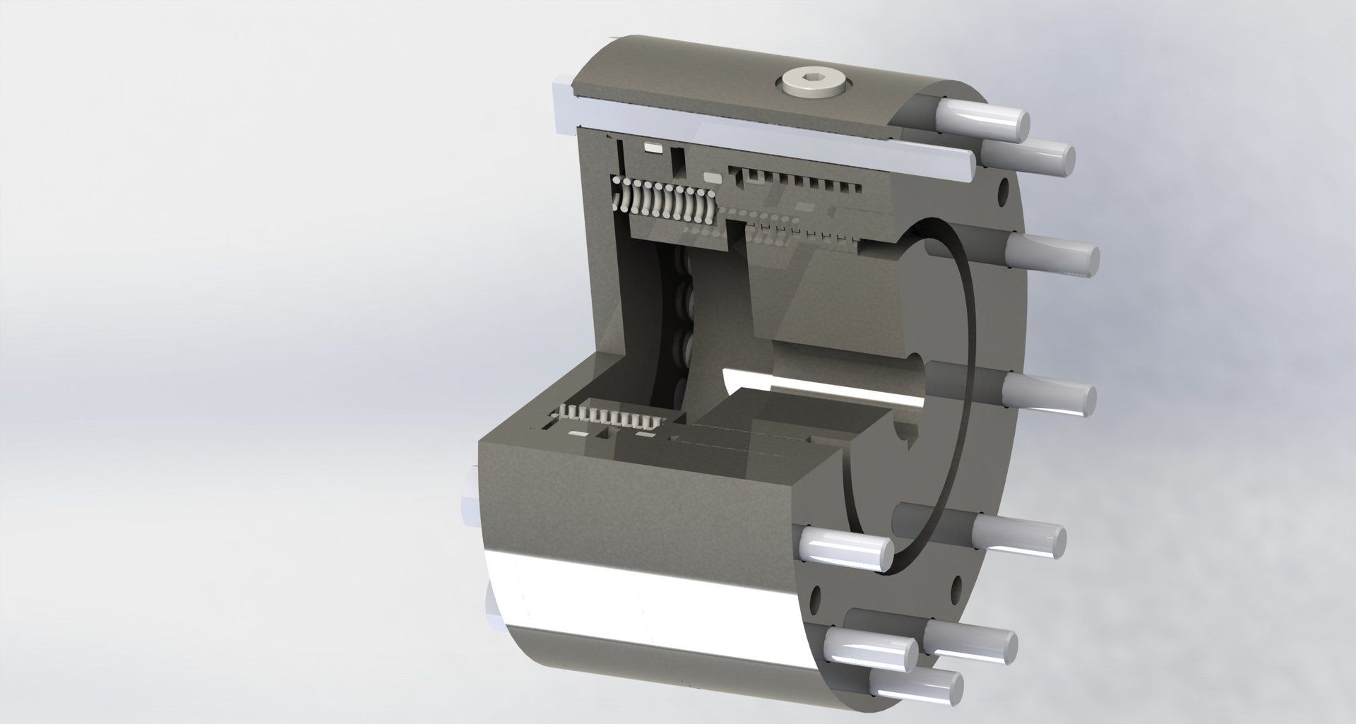 Schnittansicht eines zylindrischen mechanischen Bauteils, die interne Mechanismen und mehrere hervorstehende Rohre zeigt.