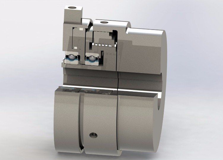 Cutaway view of a mechanical coupling with ball bearings, metal construction.