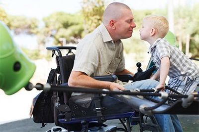 Disabled man with kid - Insurance Agency in East Longmeadow, MA Disabled man with kid - Insurance Agency in East Longmeadow, MA